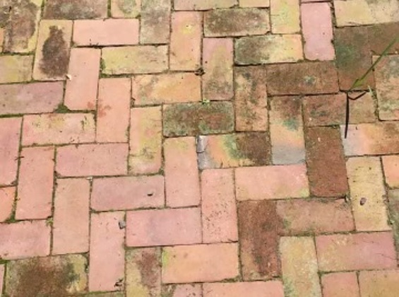 Linked closeup image of residential brick patio before restoration