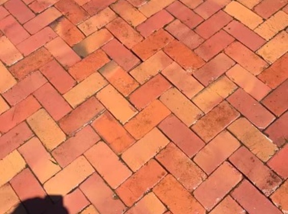 Linked closeup image of residential brick patio after restoration