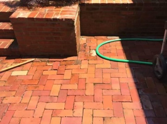 Linked image of residential brick patio after restoration